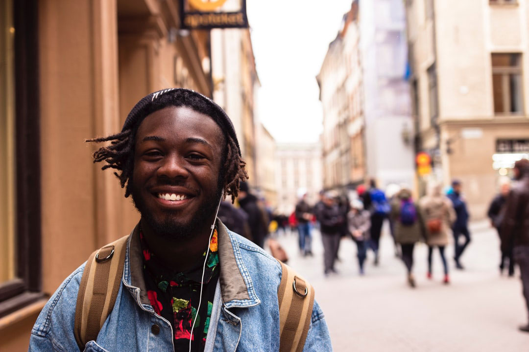 Street photography image of optimistic young man